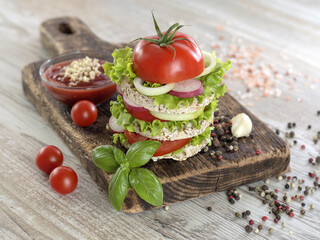 Vegetarian sandwich with vegetables on a wooden board. 