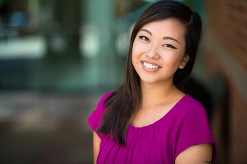 Pretty young teen teenager at school first day of college smiling hopeful and positive