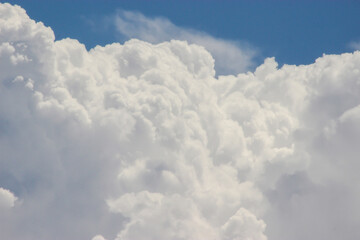 Fototapeta na wymiar Beautiful puffy clouds