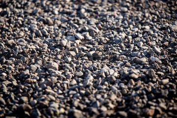 Crushed stone on the road as a background