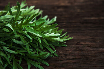 Green grass on a wooden background