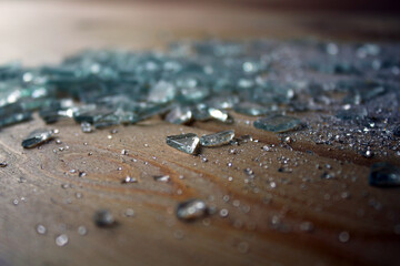 Pieces of broken glass with reflections on the surface