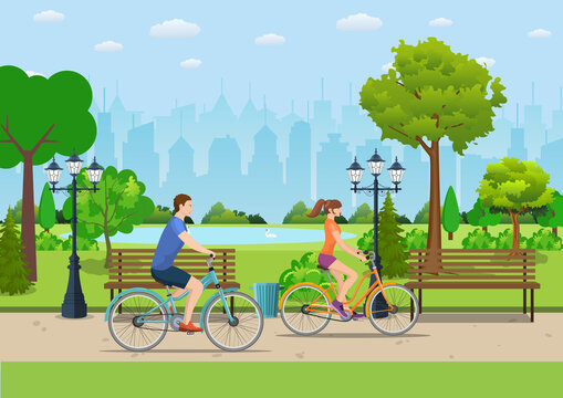 Couple Riding Bicycles In Public Park,