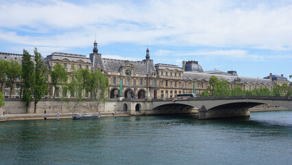 Fototapeta premium Photo of Louvre Palace on a cloudy morning, Paris, France