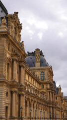 Fototapeta na wymiar Photo of Louvre Palace on a cloudy morning, Paris, France
