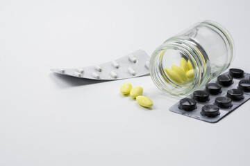 medical drug with white background , yellow and black pill