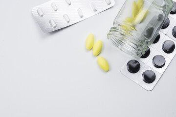 medical drug with white background , yellow and black pill