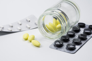 medical drug with white background , yellow and black pill