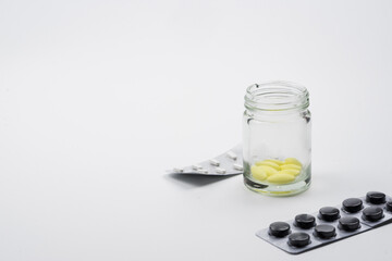 medical drug with white background , yellow and black pill