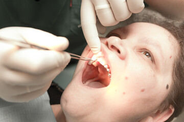 The dentist works with the client in the clinic