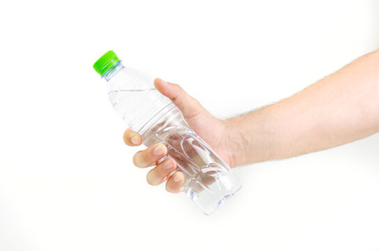 Man Hand Holding Bottle Of Water With Green Cap Isolated On White Background