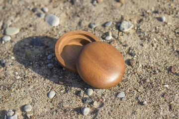 Wooden vessel in the sand between the rocks