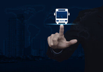 Businessman pressing bus flat icon over world map and modern city tower, Business transportation service concept, Elements of this image furnished by NASA