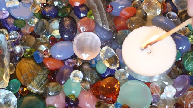 Candle fire set up top view with precious gemstones surface