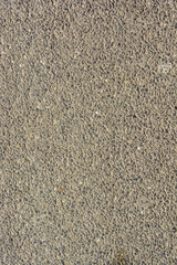 Abstract background of closeup dark uneven asphalt