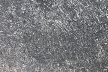 Close up of a compressed texture of fiber material. Grey background.