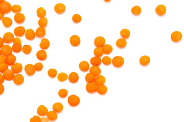 Red lentils on a white background
