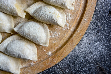 Cooking traditional Russian dumplings vareniki