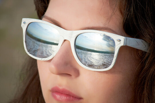 The sea is reflected in the glasses