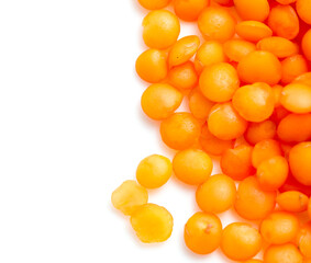 Red lentils on a white background