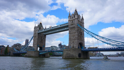 Naklejka na ściany i meble Photo of tower bridge on a cloudy spring morning, London, United Kingdom
