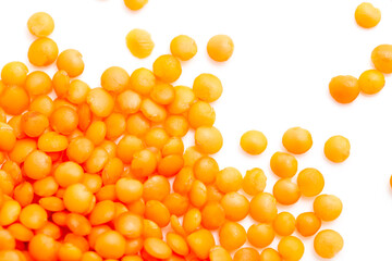 Red lentils on a white background
