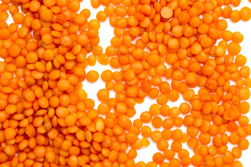 Red lentils on a white background