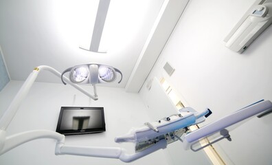 Inside a dental clinic with large halogen light