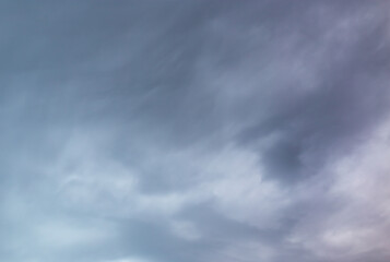 Beautiful clouds at sunset after rain as background .