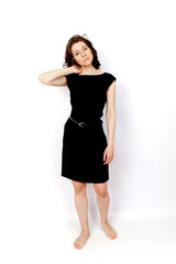 Fototapeta premium Young beautiful woman in a black dress