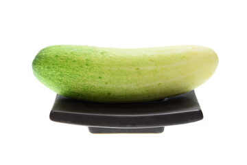 Cucumber on a plate isolated on white background