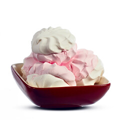 Ceramic plate with marshmallows on a white background