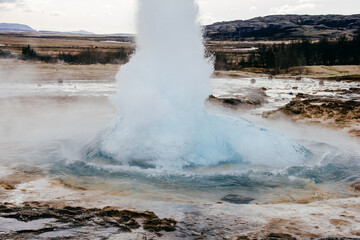.Natural landscape of the blast process of a Geyser in Iceland.