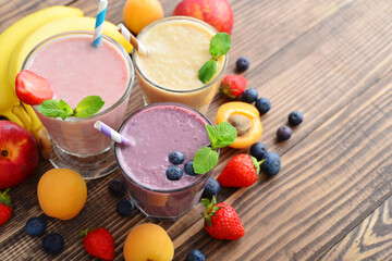 Three glass of fruit milkshakes