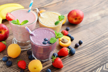 Three glass of fruit milkshakes
