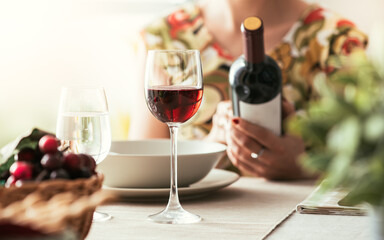 Woman reading a wine label