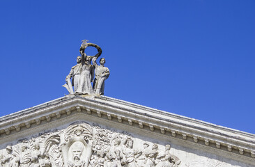 Old Statues On The Roof Of The Theatre With Blue Sky