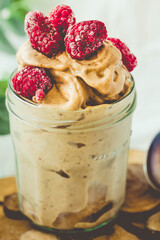 Healthy chocolate banana ice cream, raspberries.Toning.