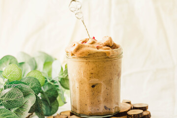 chocolate  ice cream in a glass jar, fruit delicious dessert, dairy free
