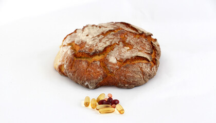 omega 3 capsules in front of  freshly baked bread