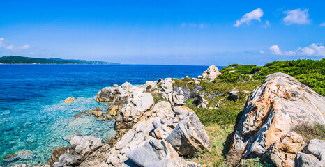 Bizarre granite rocks and amazing azure water on beautiful Sardinia island near Porto Pollo, Sargedna, Italy