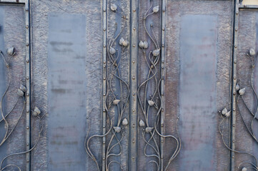 Forged decorative gates with floral element