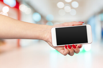 Mock up smartphone with blank screen in woman hands