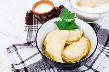 Delicious dumplings with cabbage on white background