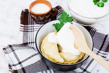 Delicious dumplings with cabbage on white background
