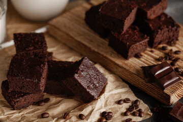 Brownie with milk on a dark background