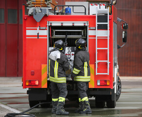 firefighters and the fire truck during a mission