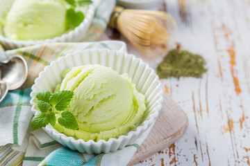 Matcha tea ice cream in white bowl