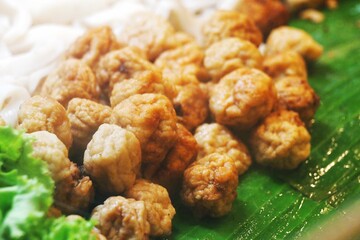 Group of shrimp balls on green banana leaf 