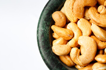 Roasted cashew nuts in a marble bowl